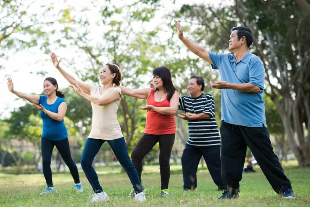 Stock image of people practicing Tai Chi. 