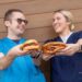 two nurses holding BBQ sandwiches