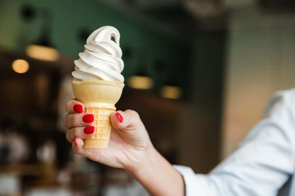 hand holding soft serve cone