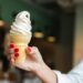 hand holding soft serve cone