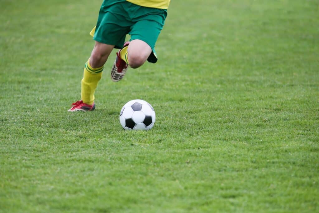 kid playing soccer