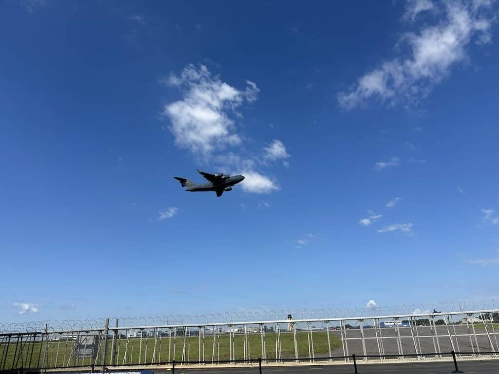 plane taking off, viewed from plaza of Sullenberger Aviation Museum plaza