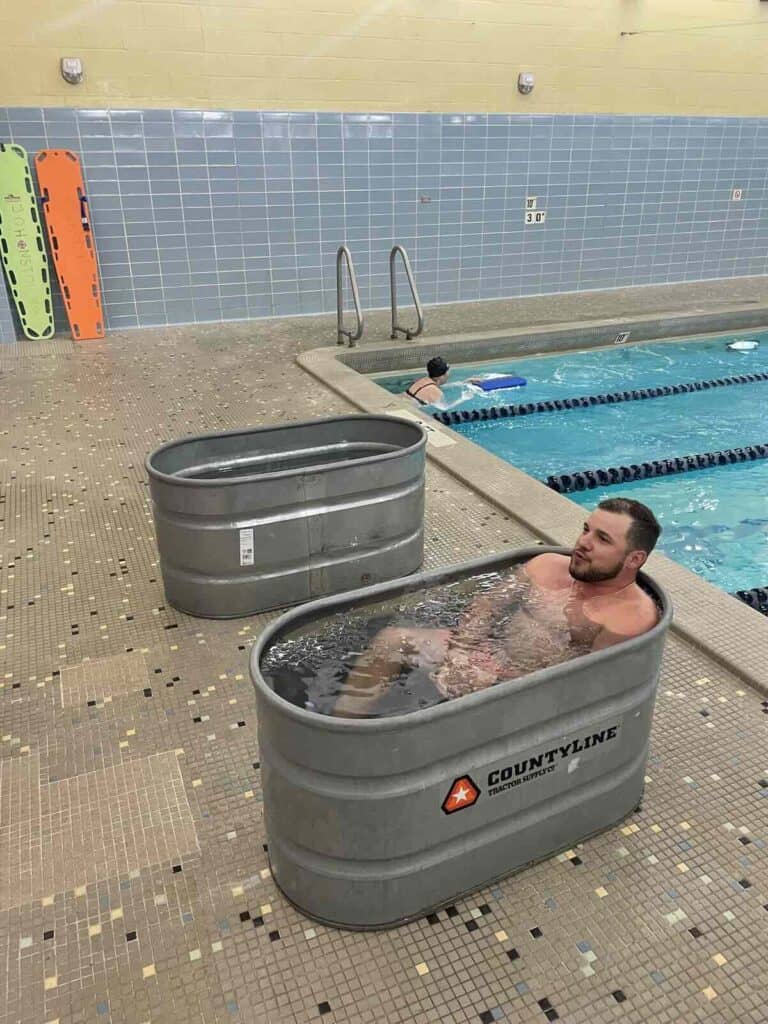 Man in icy water in metal tub at Johnston YMCA in Charlotte