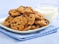 Plate of chocolate chip cookies with milk