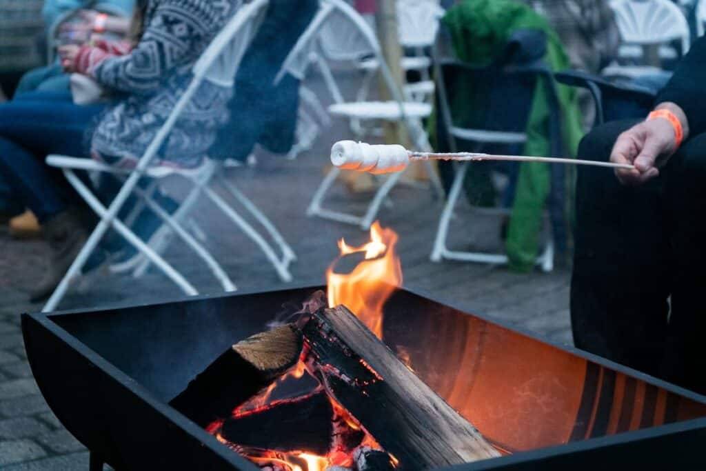 Roasting marshmallows over flame