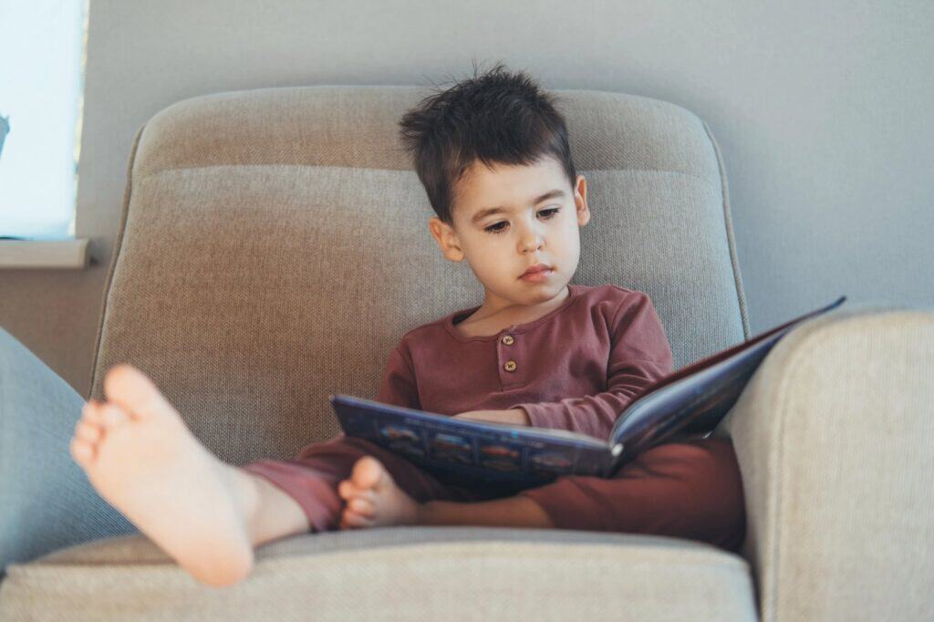Young boy reading a book