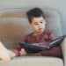 Young boy reading a book