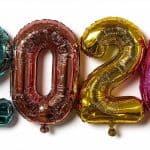 Vibrant foil balloons displaying the number 2026 on a white background