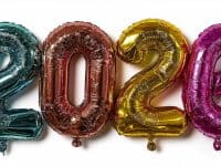 Vibrant foil balloons displaying the number 2026 on a white background
