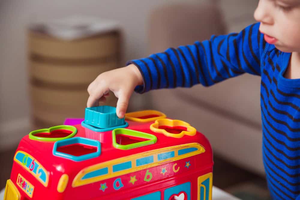 child playing with toy