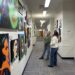 2 people looking at art