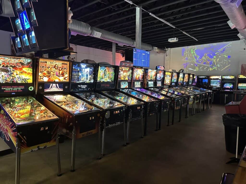 row of pinball machines at Super Abari Game Bar in Charlotte