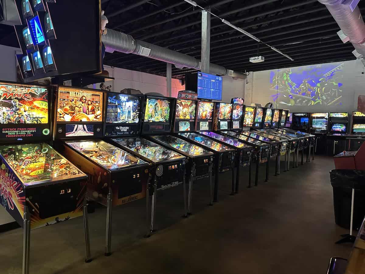 row of pinball machines at Super Abari Game Bar in Charlotte