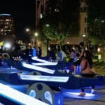 Adults and kids on light-up see saws
