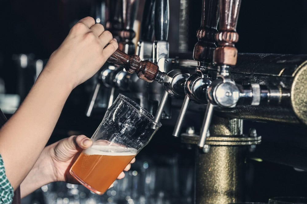 pouring beer from tap