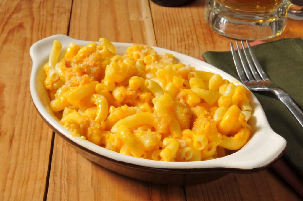 Macaroni and cheese in an individual casserole dish with bread crumbs
