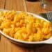 Macaroni and cheese in an individual casserole dish with bread crumbs