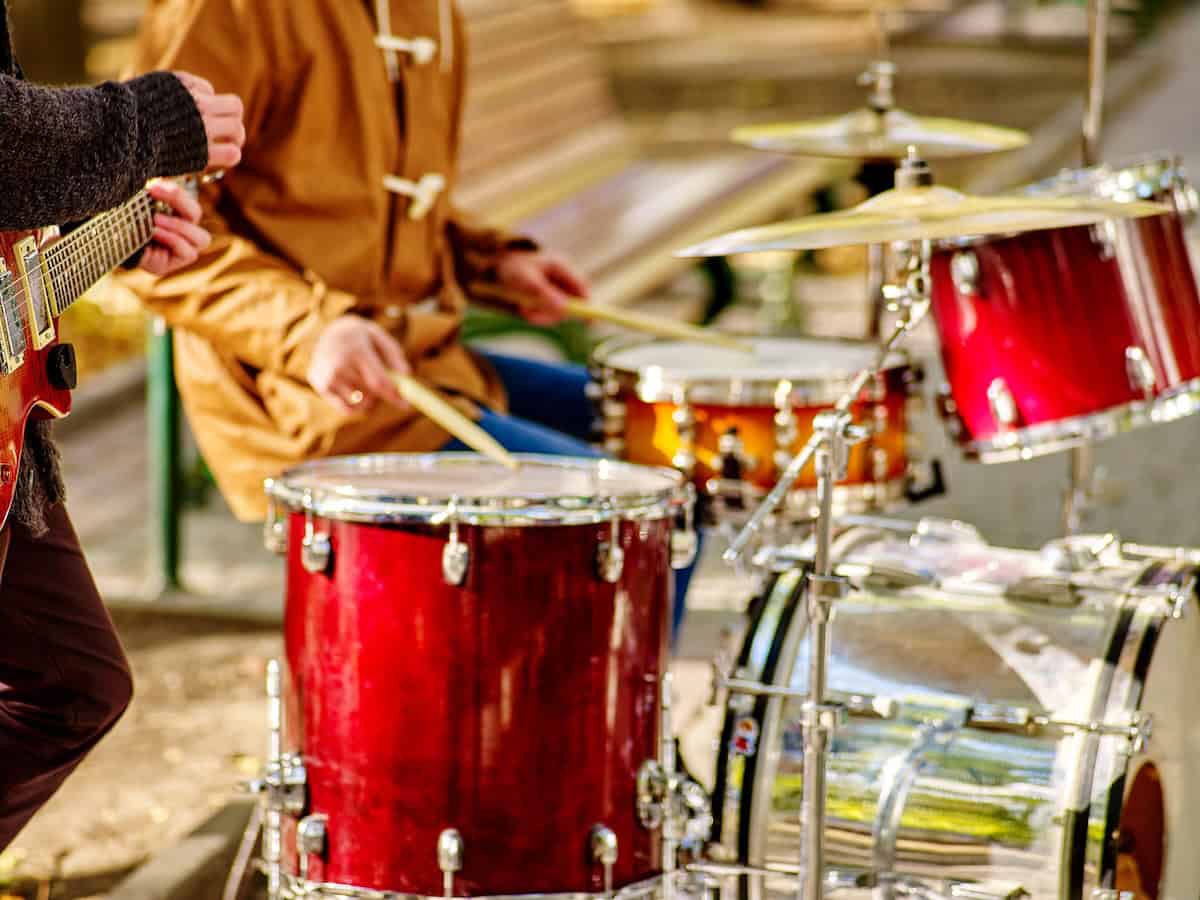 Closeup of drums and guitar at outdoor concert