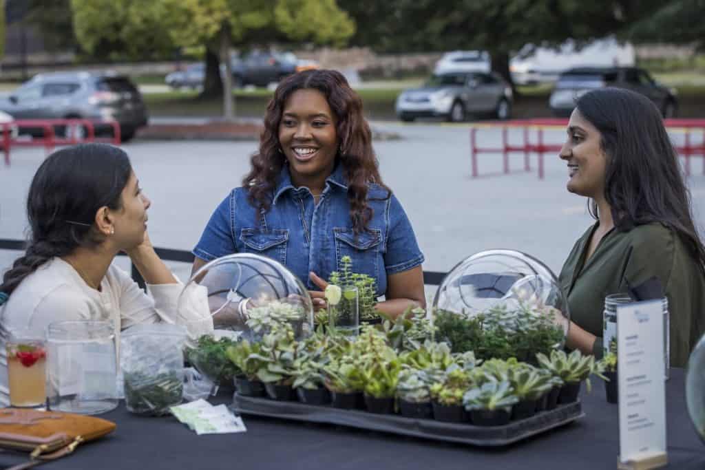 women creating garden terrariums