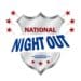 The words national night out in front of a badge