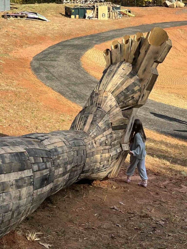 Child at Dambo Troll foot in Charlotte