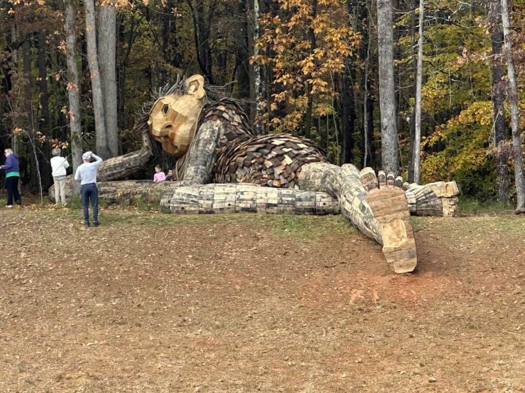 People looking at Dambo Troll in Charlotte