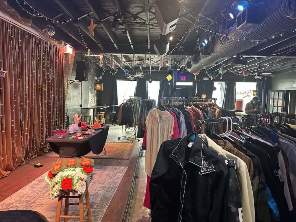 Clothes on racks at Petra's Bar