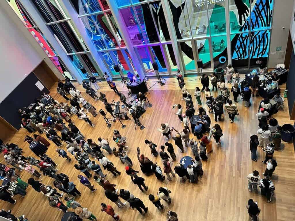 aerial view of crowd listening to music in a museum