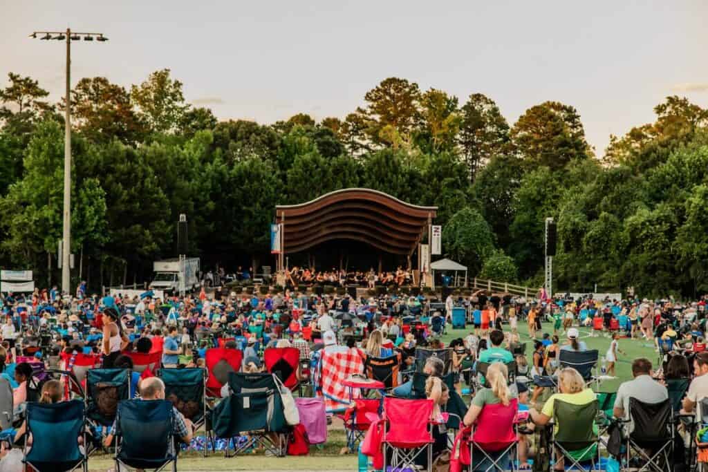 Crowd of people watching an outdoor concert