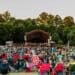Crowd of people watching an outdoor concert