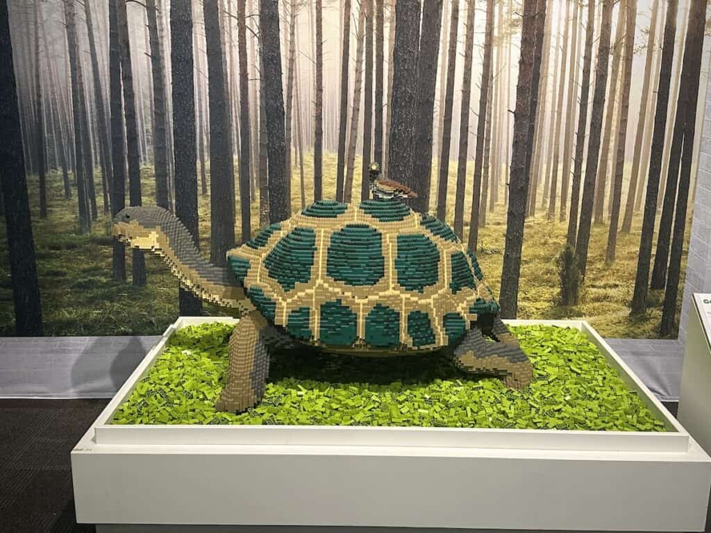 Sculpture of bird on turtle's back, made from LEGOs
