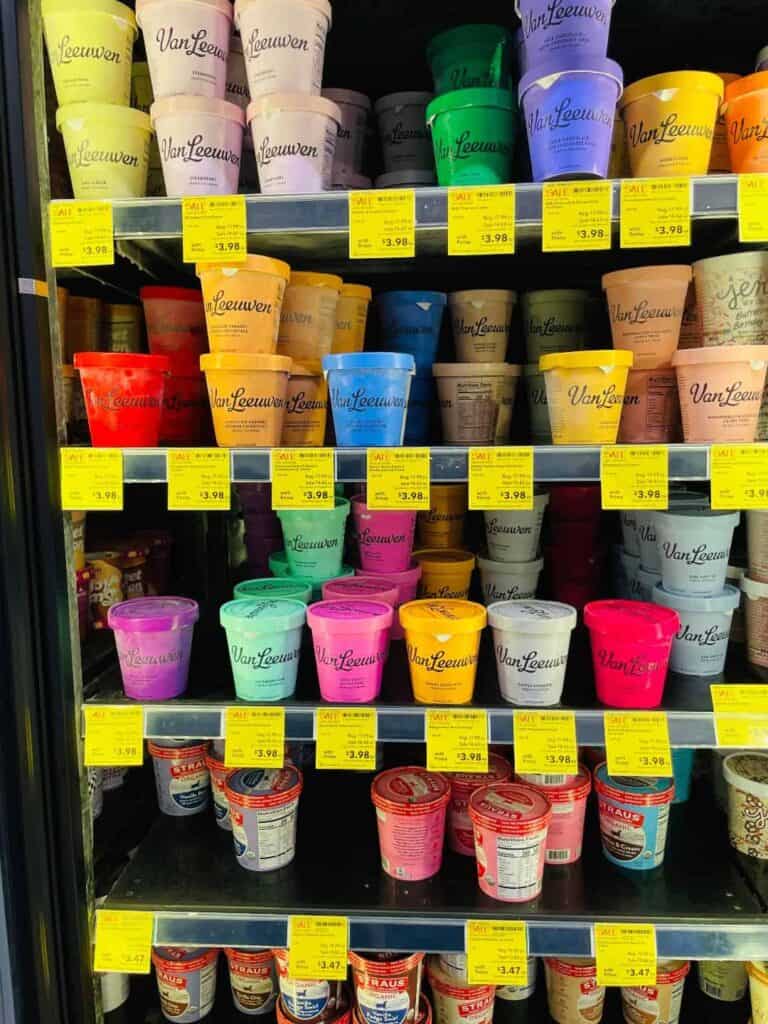 Pints of ice cream in store freezer