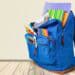 Blue backpack filled with school supplies