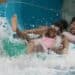 two people going down a water slide