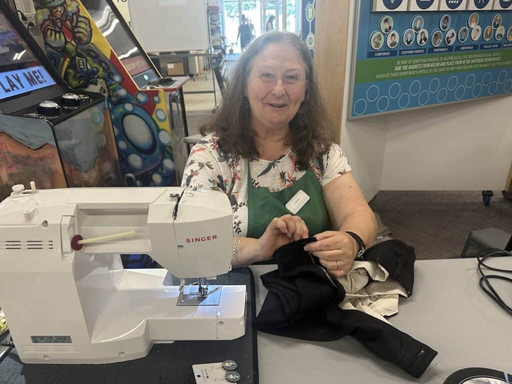 Woman sewing at Repair Cafe Charlotte