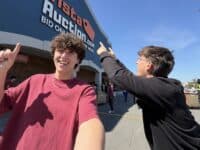 2 people in front of vista auction