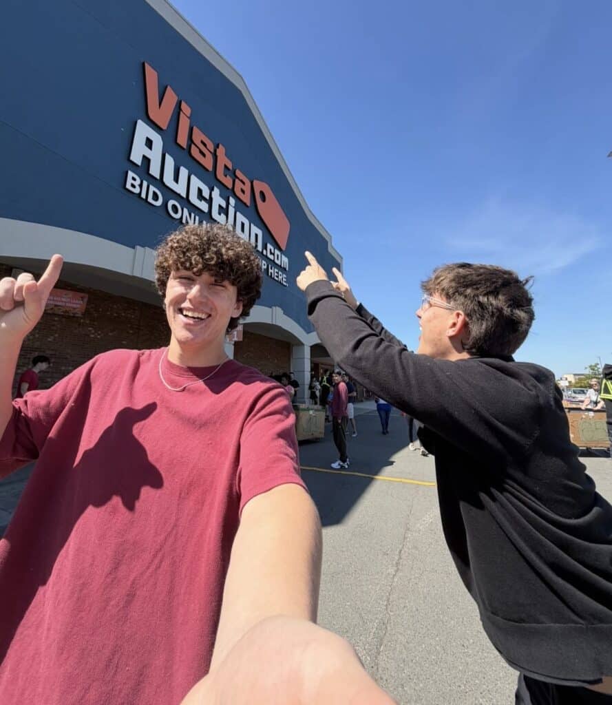 2 people in front of vista auction
