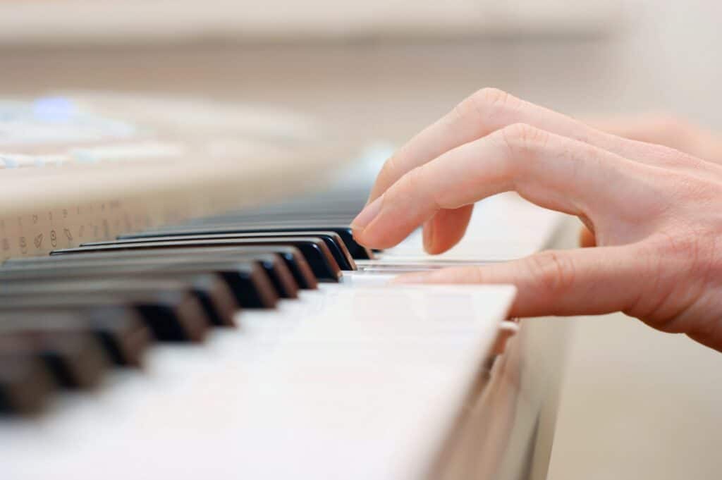hand on piano keys