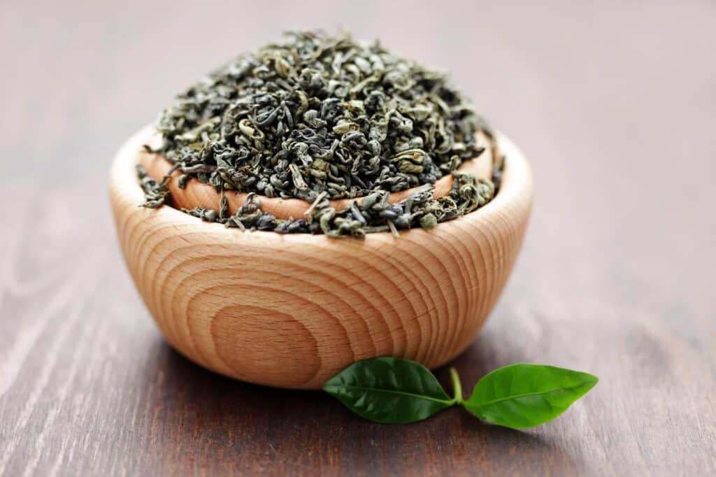Bowl of green tea leaves