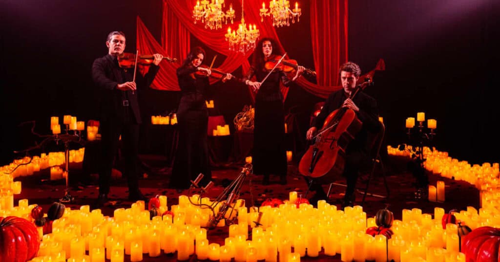 String ensemble playing in candlelight